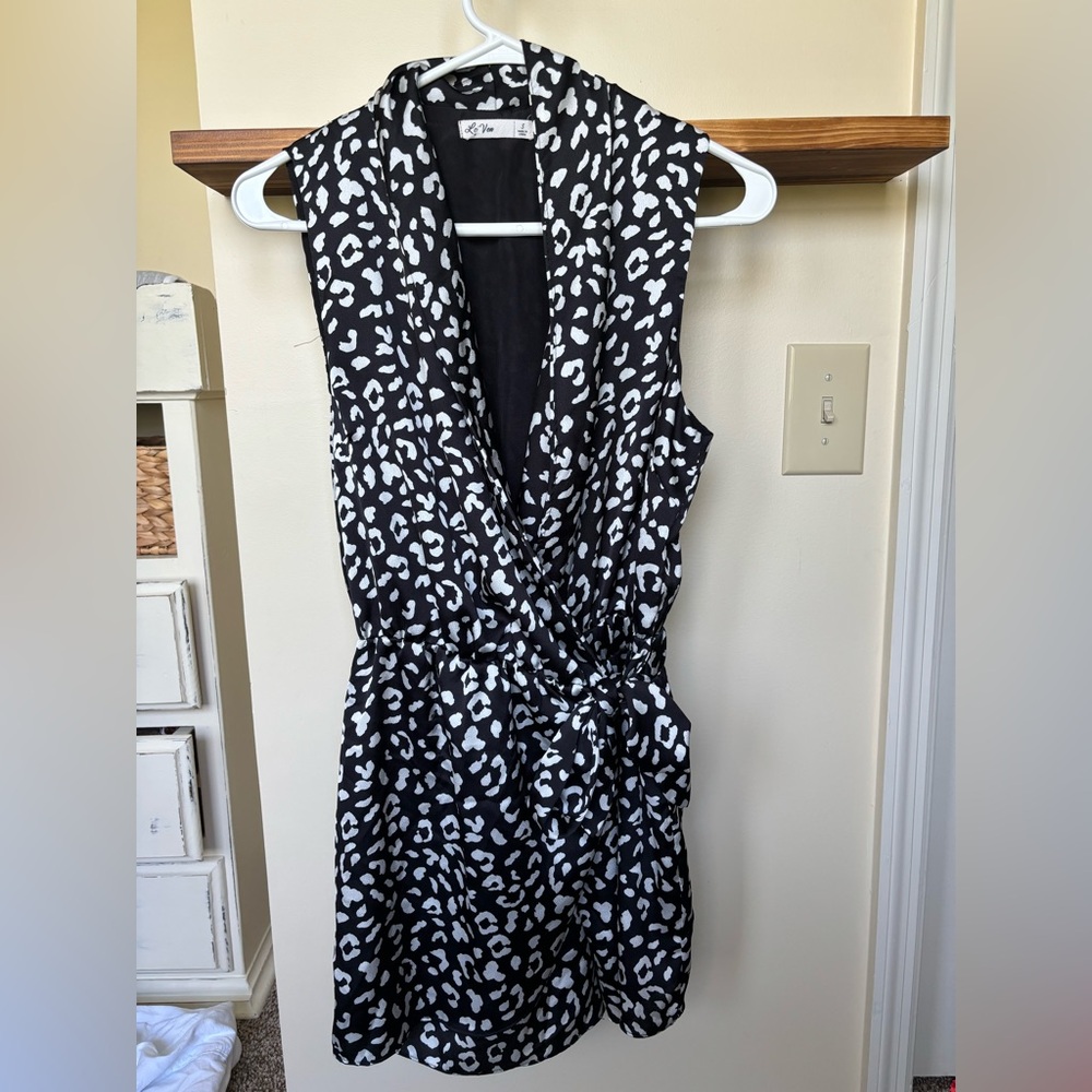 Leopard print black and white, tie front wrap romper size small